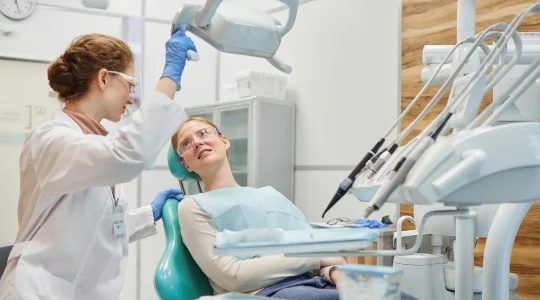 Dentist treating patient
